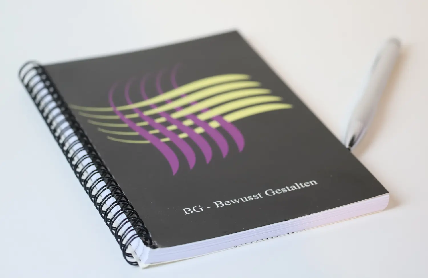 Person writes on notebook by schnack coaching